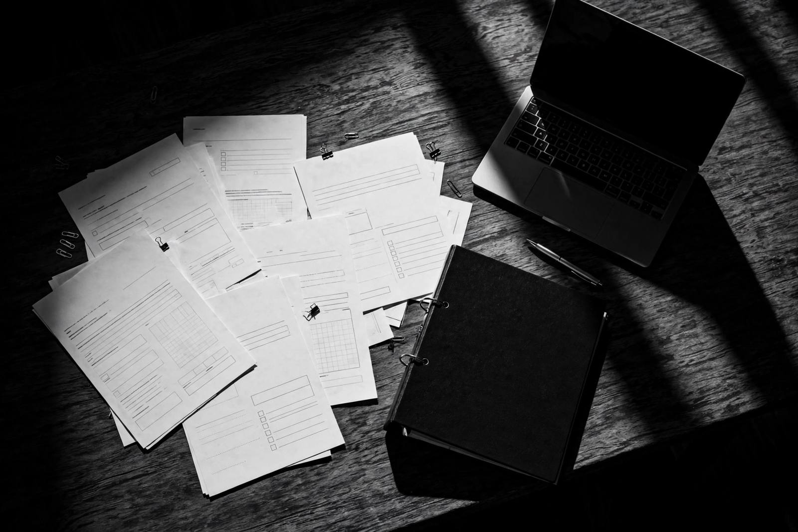 Tender documents on a desk